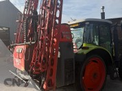 Foto van Claas- ARES 547 ATZ met Kubota spuit